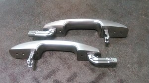 Photo of Automotive Door Handles machined at SIM to be used as a check fixture.