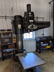 Photo of an Ikeda Radial arm drill press at Source Industries Machining in West Michigan.