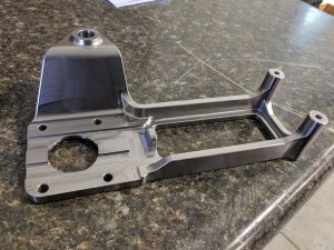 Photo of an arm rest part machined at Source Industries Machining in West Michigan.